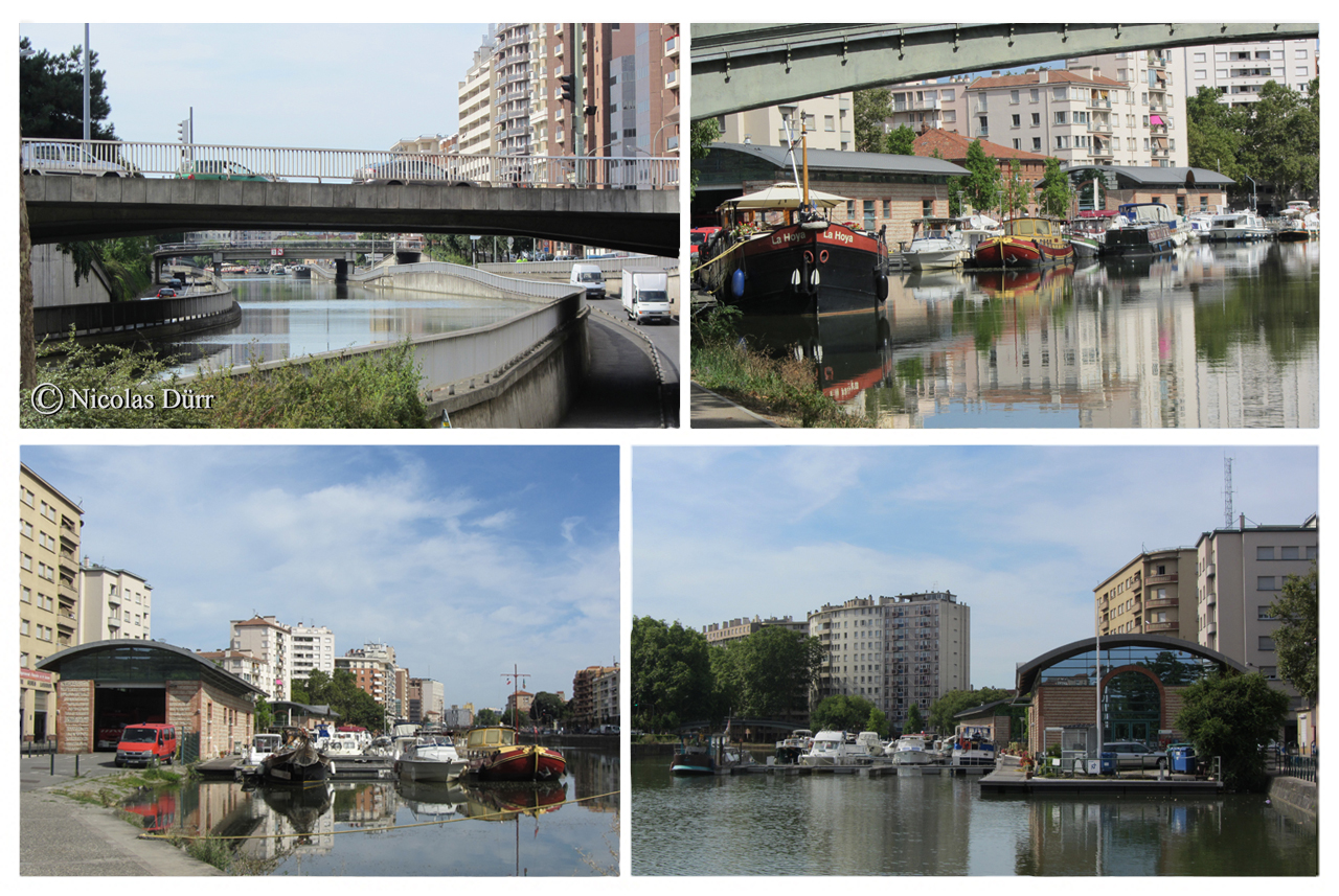 Le port St Sauveur et, au niveau du pont Guilhemery sur la photo en haut à gauche, l'emplacement de l'ancien port St Etienne. Le bâtiment des archives du Canal du Midi se situe à proximité (en données 2012).